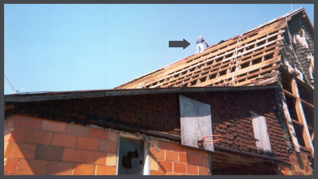 Historic restorationist Eric LaVelle demolishing a barn