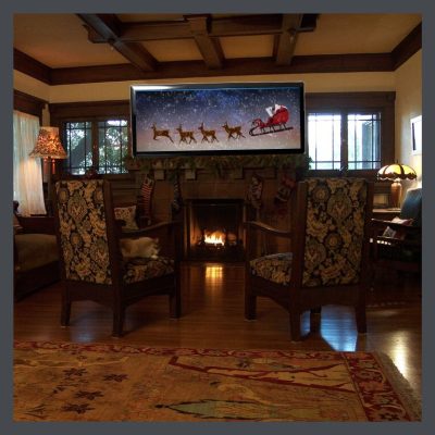 TV over fireplace in Craftsman house- one of the most serious Bungalow interior design mistakes. 