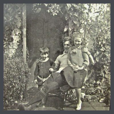 Family in front of an old house